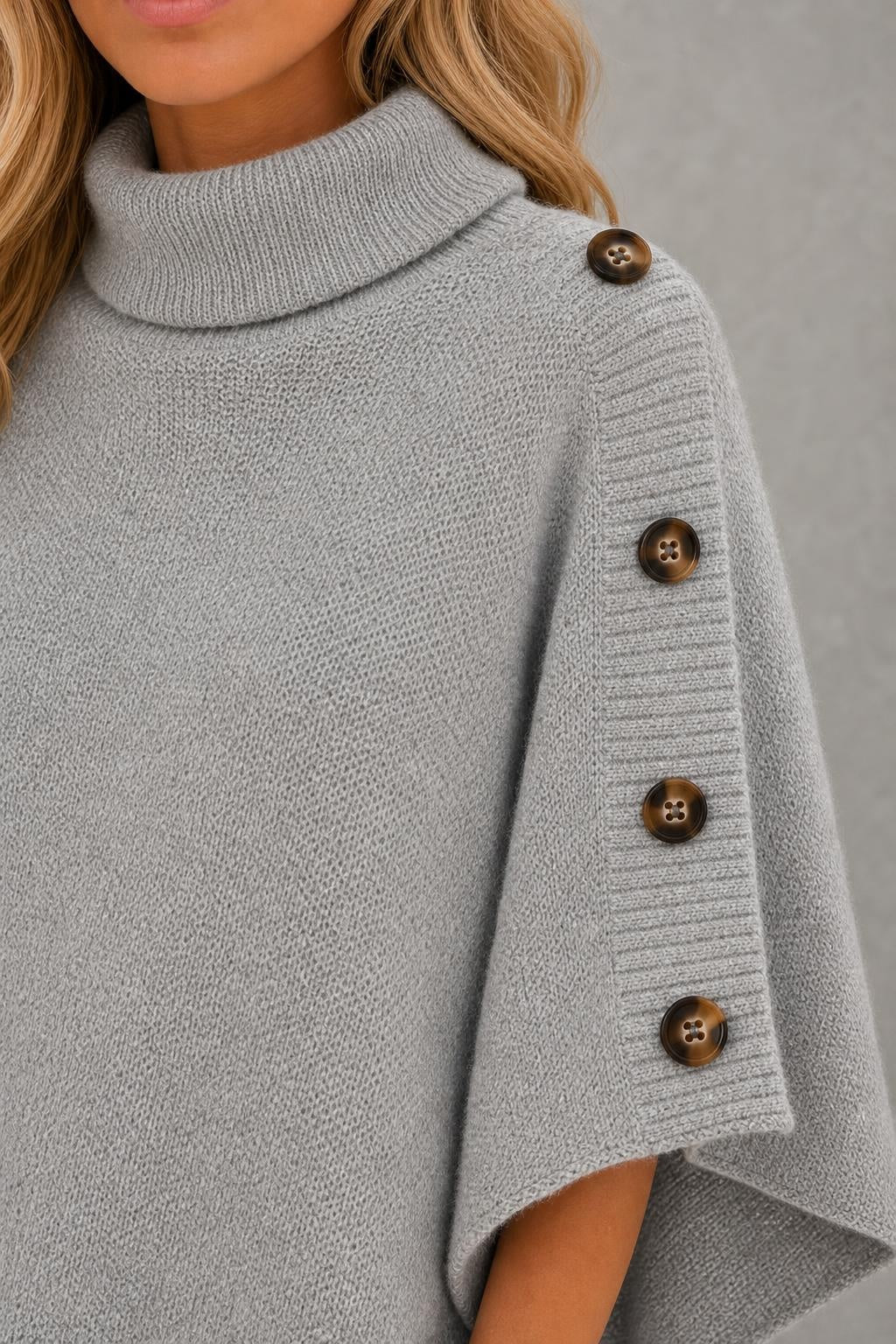 Darcie | Button-Shoulder Asymmetric Knit Poncho — studio_closeup — Sofia [b7268815-6c68-435b-93b6-70c15d1ce5d2]